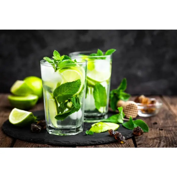 Mojito in glasses with lime, mint and ice