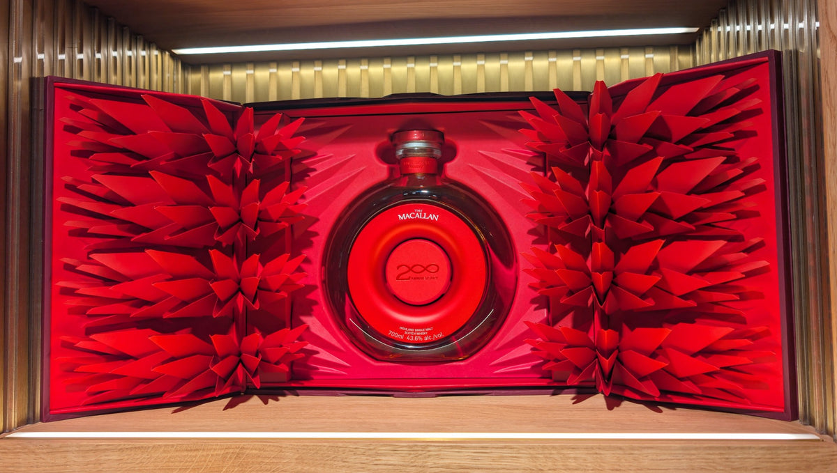 The Macallan Time : Space Mastery - round bottle in an open red gift box